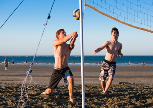 Brothers play beach volleyball, Nelson