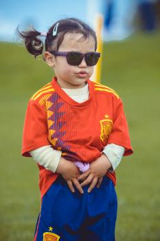 Little girl wearing purple sunglasses and Manchester United kit - Little Dribblers