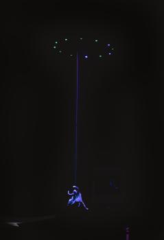 UFO hovering over a dance performer