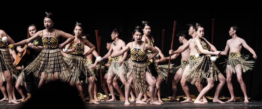 Male and female students in traditional skirts for Kapa Haka