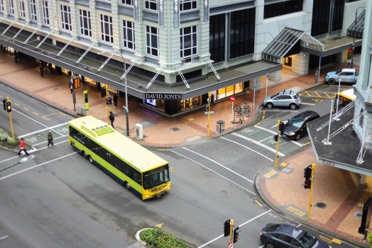 Yellow bus crossing intersection