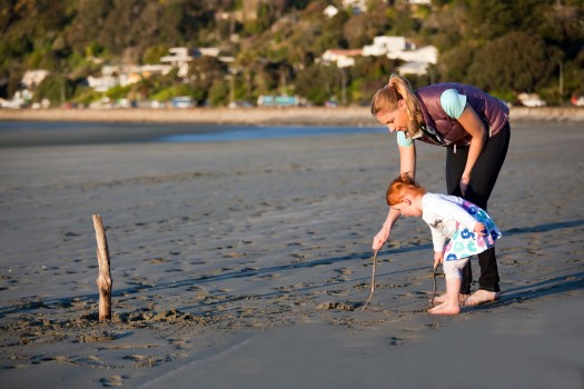 Kiwi toddler with mother on Tahunanui, Nelson