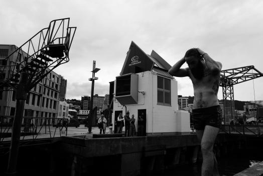 Tattooed man on the wharf black and white