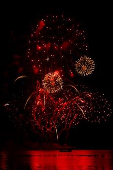 Red firework light and sea