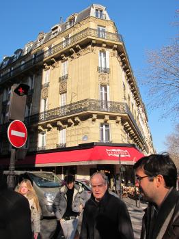 People in the street and Le Kleber restaurant in Paris