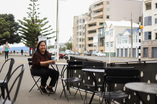 Woman sitting outside a coffee shop