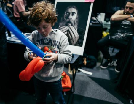 A child with balloon at Wellington tattoo convention 2021