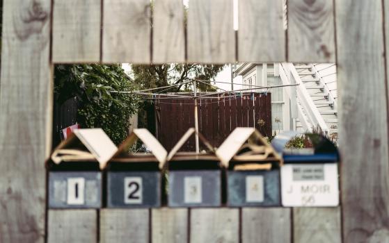 Mailboxes in wooden fence bokeh