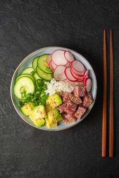Top down view of 'poke' dish with chopsticks