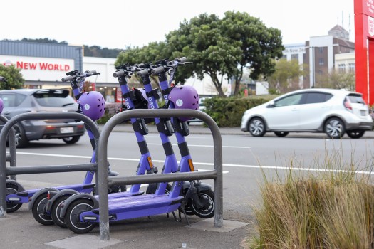 Parked purple coloured scooters