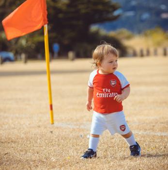 Boy in Arsenal kit at Little Dribblers socccer competition