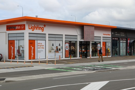Lighting Plus store with orange accents