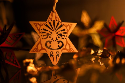 Pohutukawa star ornament on yellow background