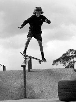 Boy Skateboard Rail Slide Jump trick