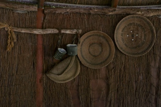 Hand woven basket lids hanging on the wall