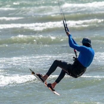 Kite surfer above the waves
