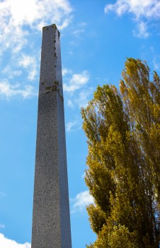 War Memorial obelisk covered with algae