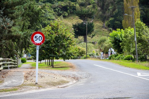 Speed limit sign next to tarmac