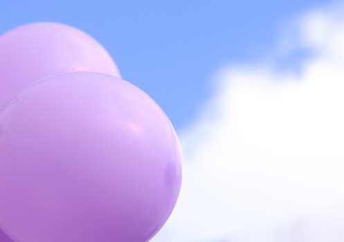 Purple balloons against blue sky, R4L 2022