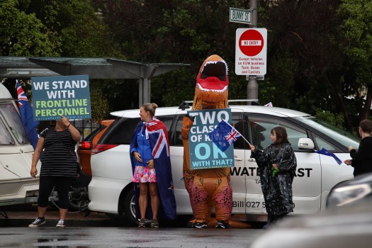Dinosaur holding sign - Convoy 2022 protest