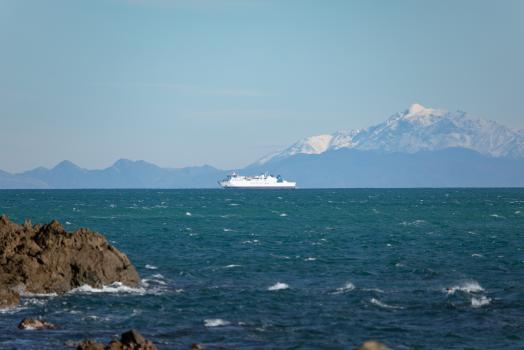 Snow capped mountains and a ship