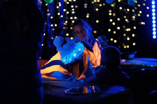 Face painting and blue yellow light bokeh at LUX festival 