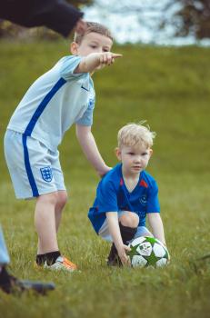 Boy pointing opponent team player - Little Dribblers
