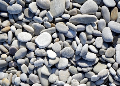 Textured white pebbles on a beach