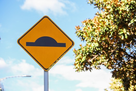 Diamond shaped 'speed bump' road sign