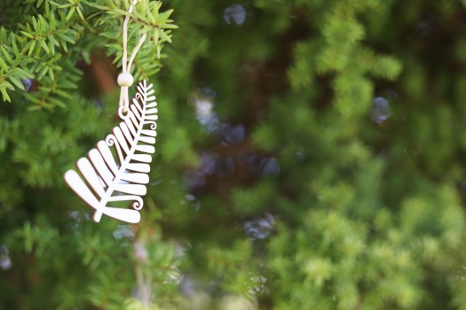 Fern cutout dangling from a tree