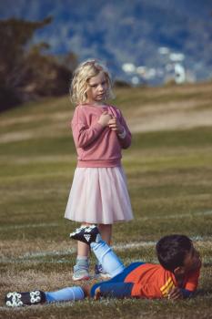 Girl in pink sweater skirt and blonde hair - Little Dribblers
