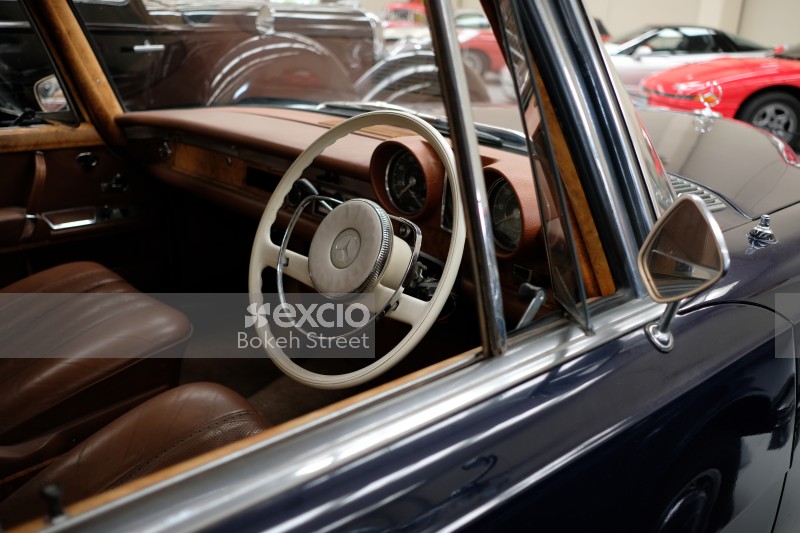 Blue Mercedes brown interior white steering wheel classic car