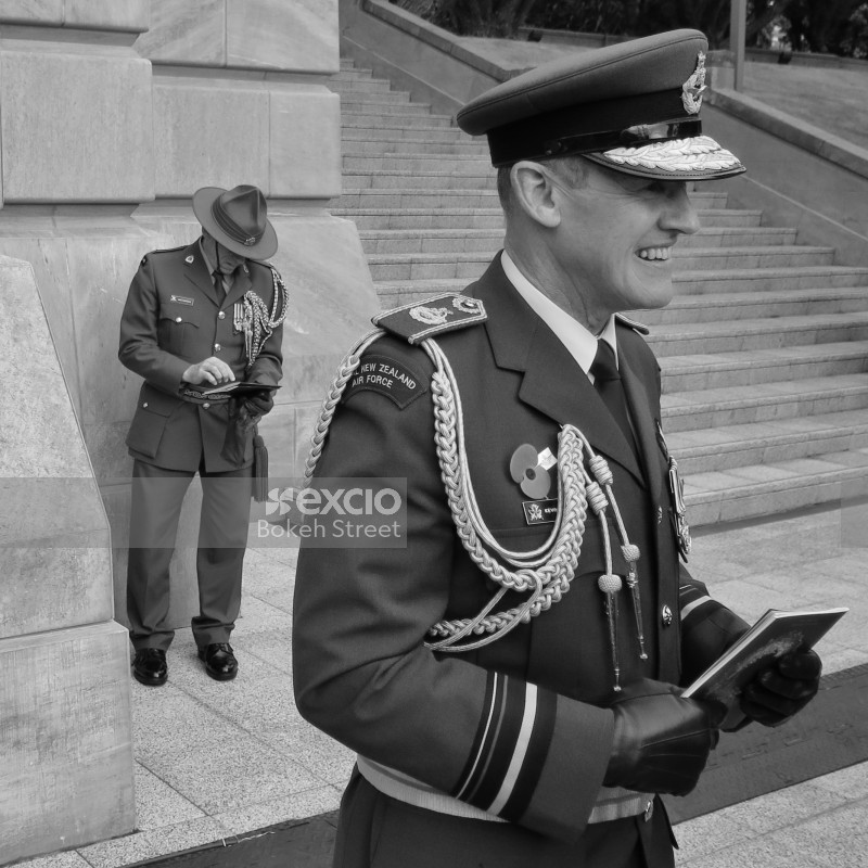 Uniformed officers at an event monochrome