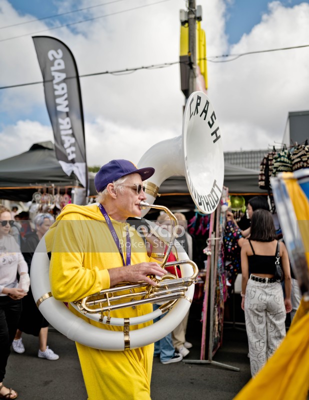 Old guy in a yellow onesie playing sousaphone at Newtown festival 2021
