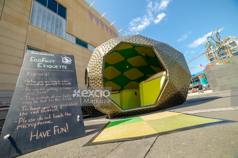 Eggfruit shaped booth and instructions on a black board