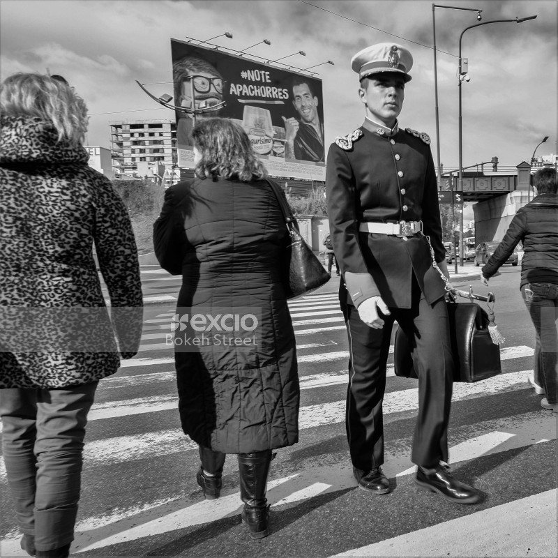 Uniformed soldier carrying a bag on zebra cross leopard print black and white