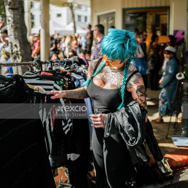 Tattooed cyan braided hair woman at Newtown festival 2021