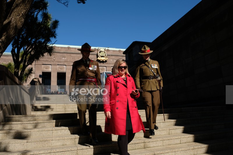 Uniformed soldiers escorting a lady on Anzac Day 2017