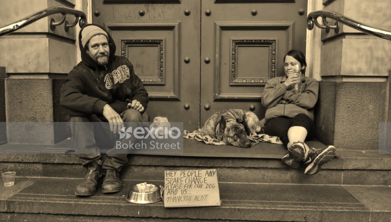 Homeless people with sign