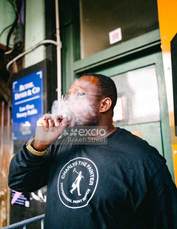 Smoke billowing from a cigar puff at Newtown festival 2021