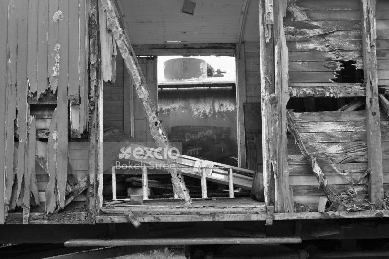Damaged old wooden freight bogie black and white