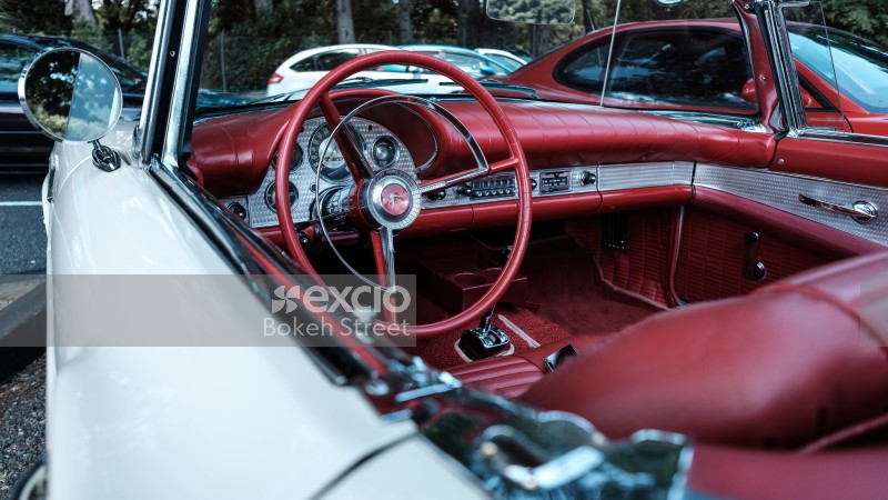 White convertible classic car with red interior