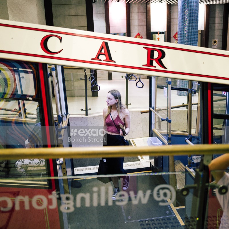 Member of the public entering cable car