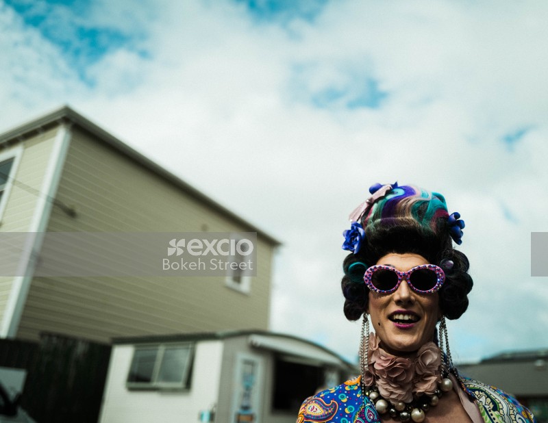 Woman with multicoloured hair and funky glasses at Newtown festival 2021