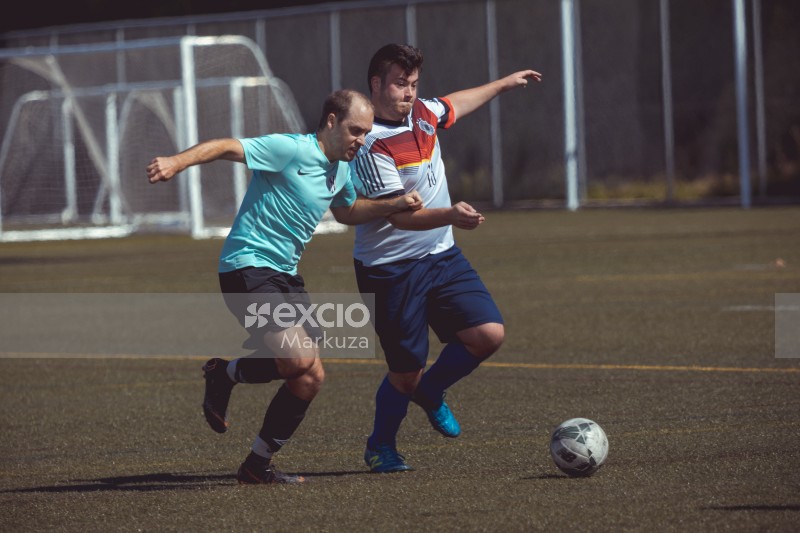 Valley FC player shoving away an opponent - Sports Zone sunday league