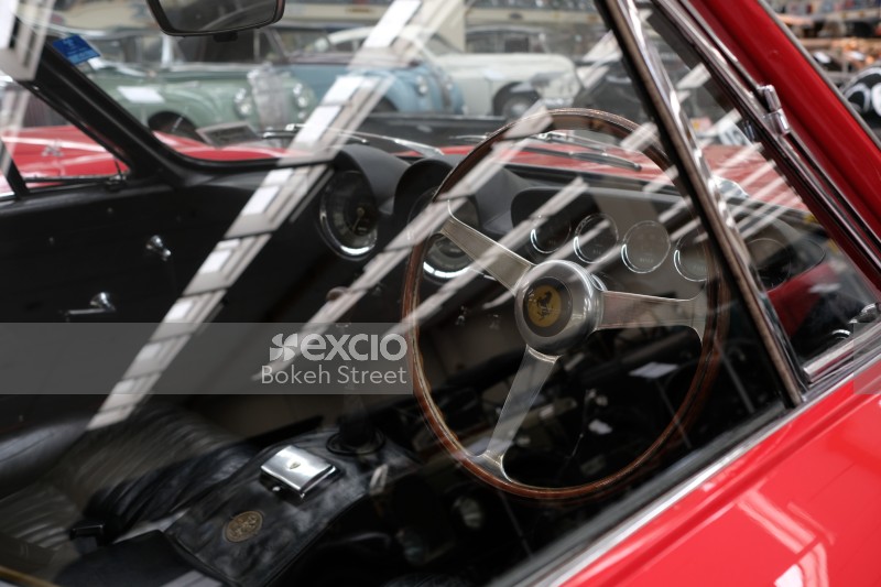 Black interior red classic Ferrari wood steering