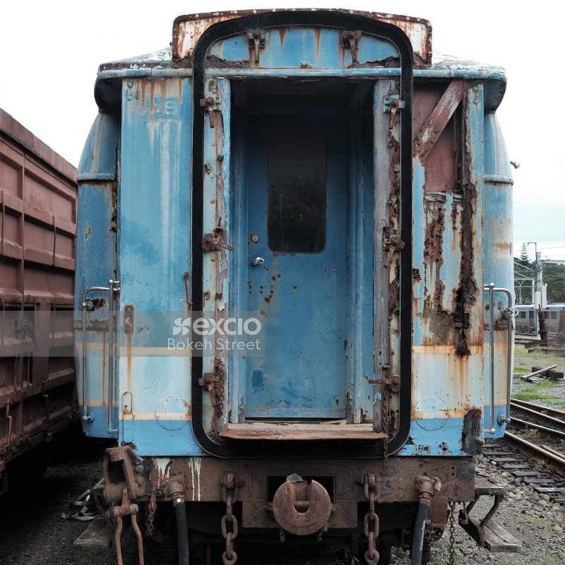 Blue passenger bogie of an abandoned old train