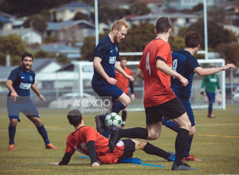 Player in red shirt slide tackle opposing team player - Sports Zone sunday league