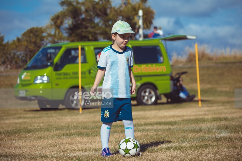 Argentine kit wearing girl with football - Little Dribblers
