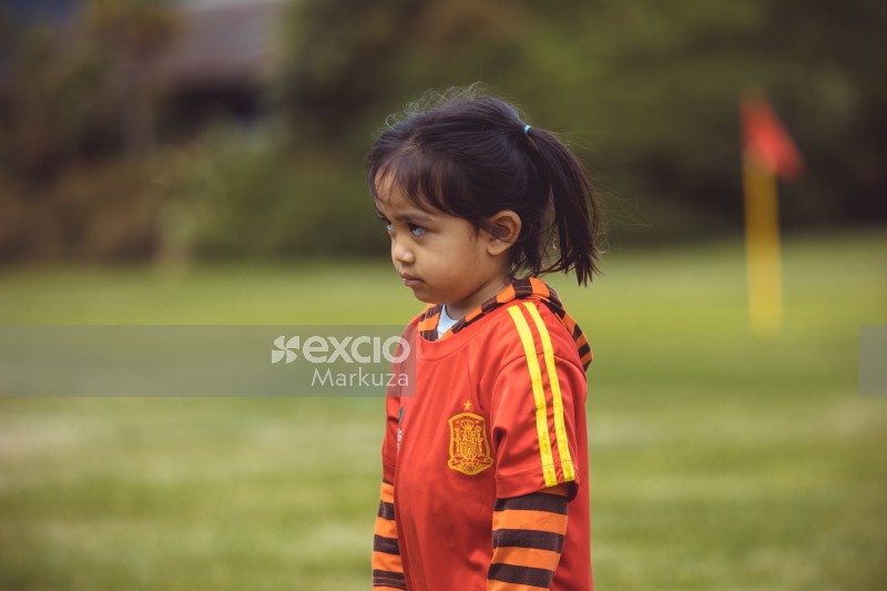Little girl in Spanish kit at Little Dribblers ball game